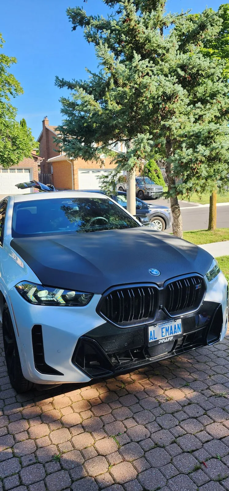 BMW with carbon fiber hood wrap, front view