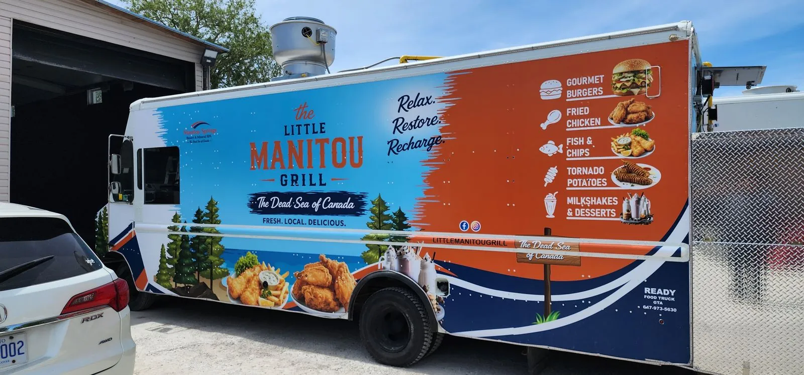 Full branding graphics on The Little Manitou Grill food truck