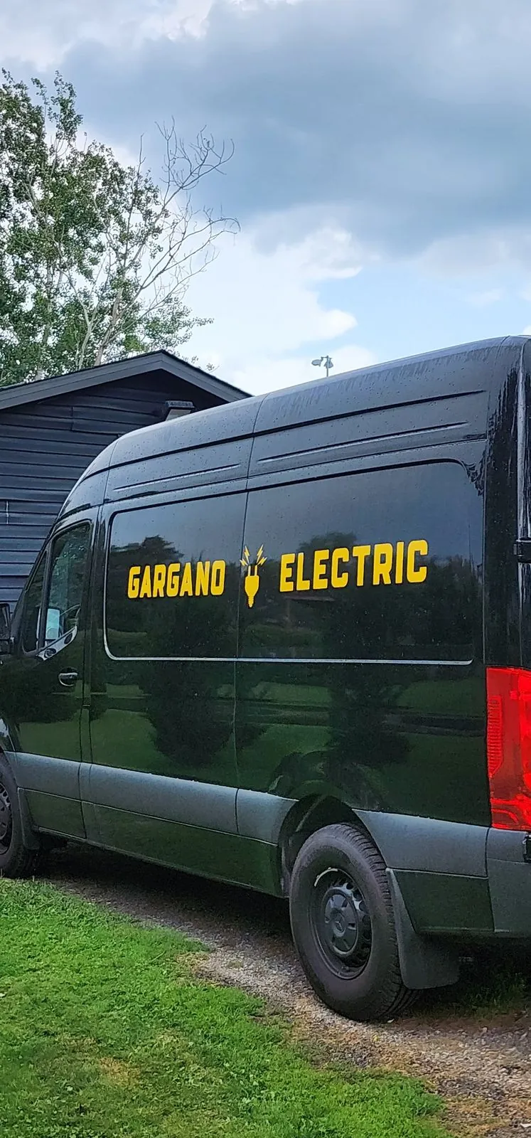 Gargano Electric Sprinter van with yellow fleet side lettering