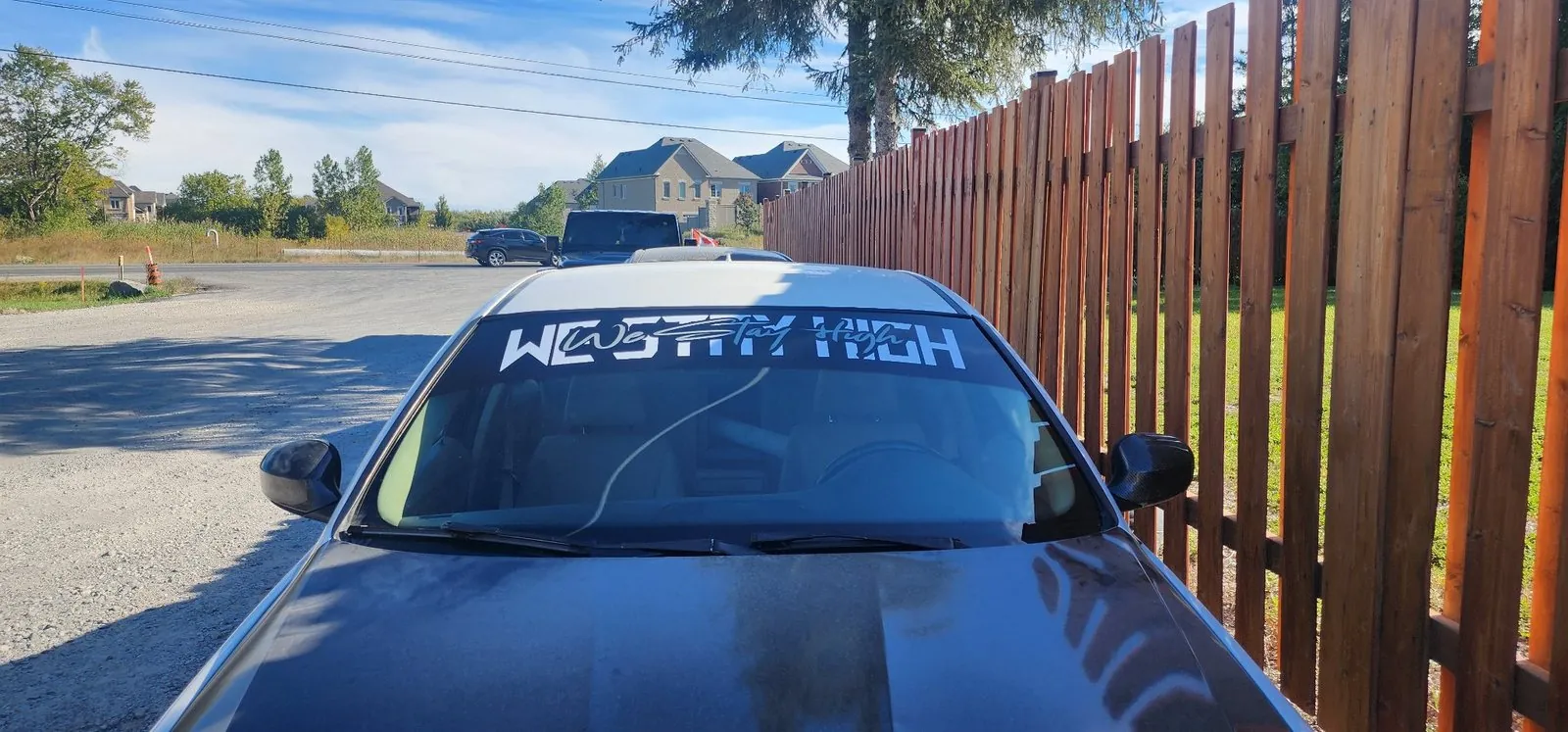 Custom windshield banner on a car